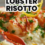 Close-up of creamy lobster risotto garnished with lemon zest and fresh parsley