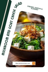 Bowl of mixed greens salad with feta cheese, walnuts, and crispy fried onions served on a wooden board.
