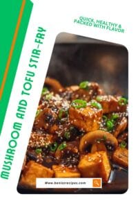 Close-up of sizzling mushroom tofu stir-fry with golden tofu cubes, mushrooms, sesame seeds, and green onions in a glossy soy glaze