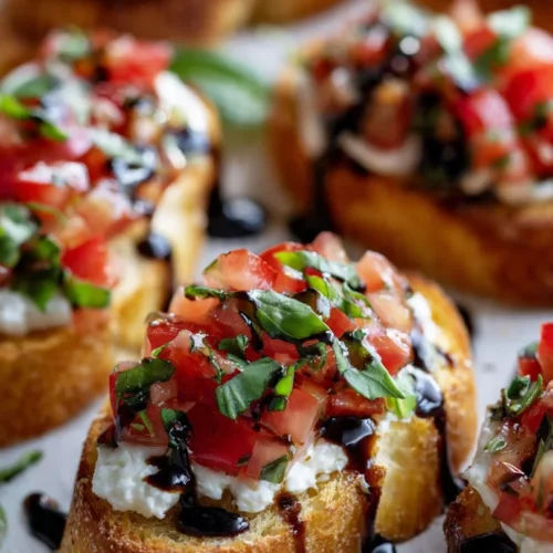 Crispy Italian bruschetta topped with mozzarella cheese and fresh herbs