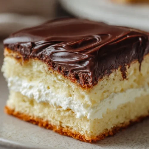 5-Ingredient chocolate eclair cake with chocolate frosting and graham crackers