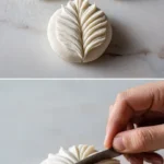 A plate of beautifully braided leaf dumplings, showcasing intricate folding techniques.