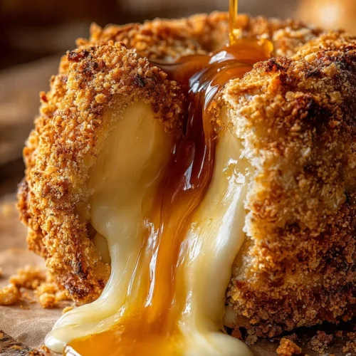 Delicious caramel banana cheesecake bombs topped with creamy caramel drizzle.