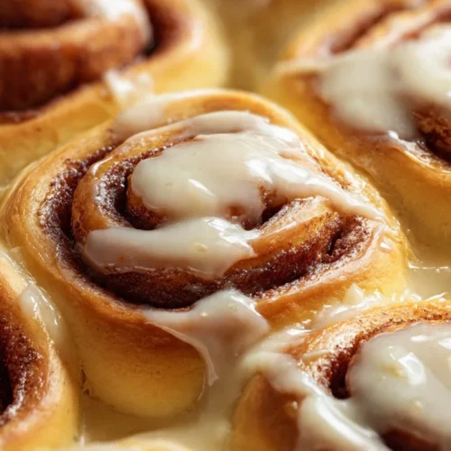 Delicious homemade carrot cake cinnamon rolls topped with cream cheese frosting