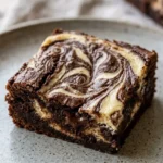 Delicious cheesecake brownies recipe with chocolate and creamy topping