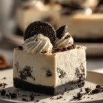 Decadent Peanut Butter Oreo Pie topped with crushed Oreos and creamy peanut butter