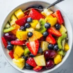 Colorful easy fruit salad with a variety of fresh fruits in a bowl
