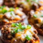 Hot honey ground beef served in sweet potato boats for a flavorful meal.