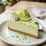 No-bake Key Lime Cheesecake topped with lime zest and chill for a refreshing dessert.