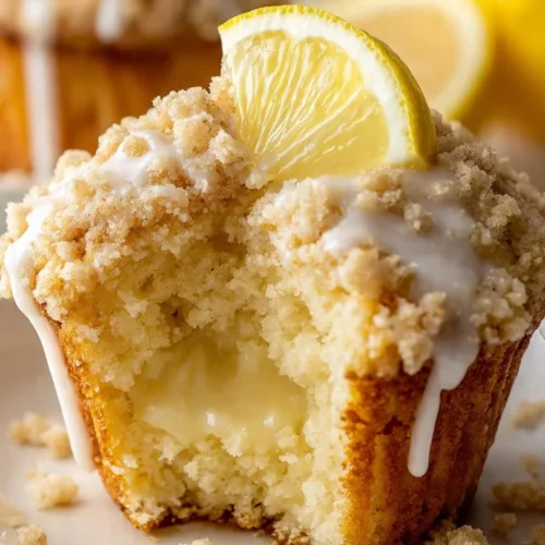 Freshly baked Lemon Cream Cheese Muffins on a cooling rack.