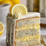 Lemon poppy seed cake drizzled with sweet glaze on a white plate