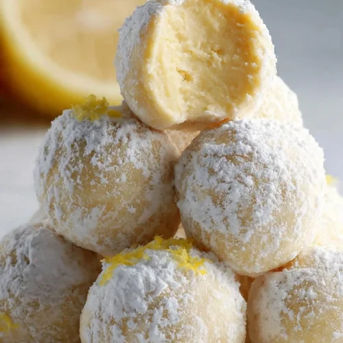 Lemon white chocolate truffles with a creamy filling and lemon zest topping.