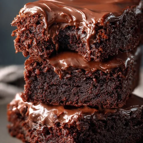 Batch of Lunch Lady Brownies on a plate, rich chocolate dessert