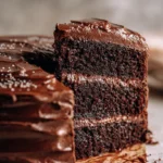 Delicious slice of Matilda's Chocolate Cake topped with chocolate frosting