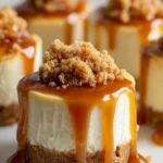 Mini caramel cheesecakes topped with rich caramel sauce.