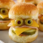 Mini sandwich monsters made with colorful ingredients for fun snacks
