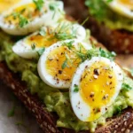 Mediterranean avocado egg salad with fresh ingredients served in a bowl