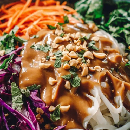Delicious spring roll salad topped with creamy peanut dressing