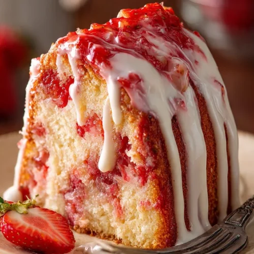 Strawberry Earthquake Cake with Cream Cheese topped with fresh strawberries