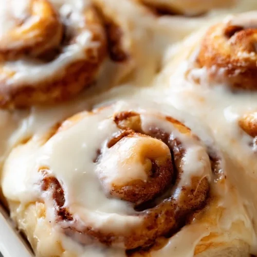 Delicious homemade cinnamon rolls topped with creamy icing