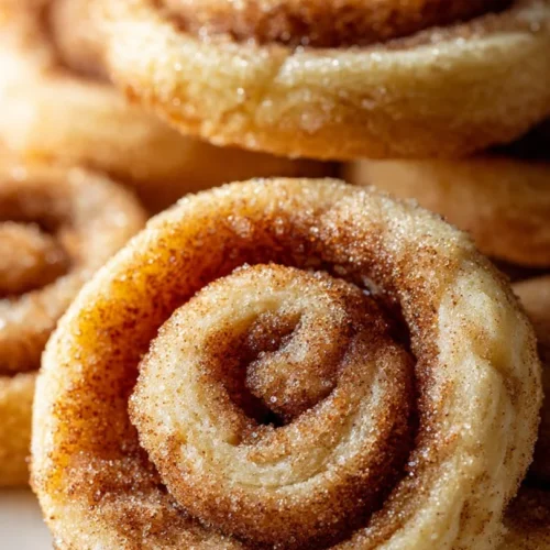 Plate of chewy brown butter sugar cookies with a golden-brown finish.