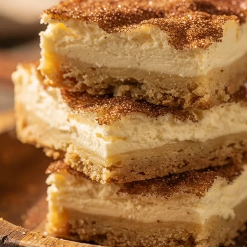 Delicious Churro Cheesecake Bars with cinnamon-sugar topping