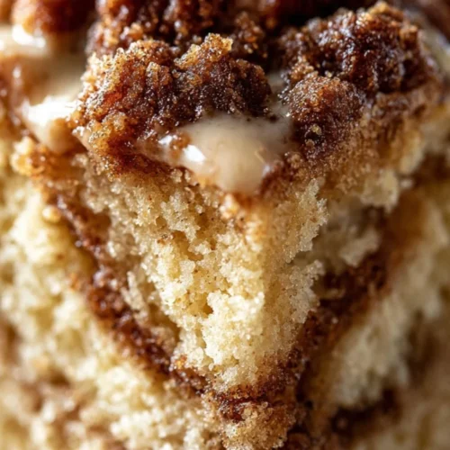 Delicious homemade coffee cake with crumb topping and coffee cup