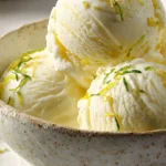 Refreshing lemon basil sorbet served in a bowl with mint leaves