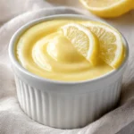 Delicious lemon custard served in a glass dessert bowl