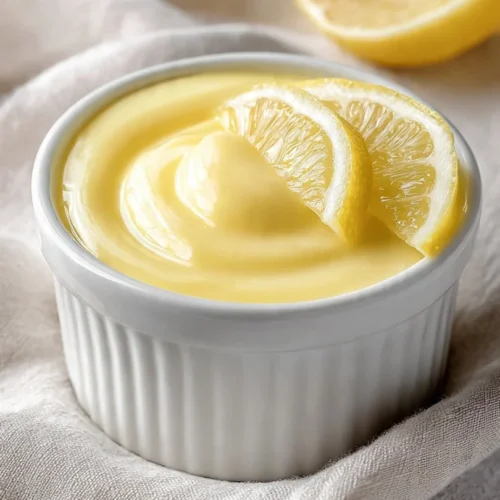 Delicious lemon custard served in a glass dessert bowl