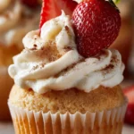 Delicious Mexican Three Milks Cupcakes topped with cream and colorful sprinkles.