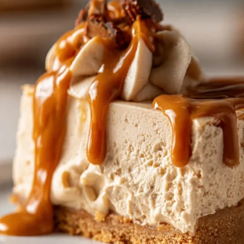 No bake peanut butter pie topped with whipped cream and chocolate