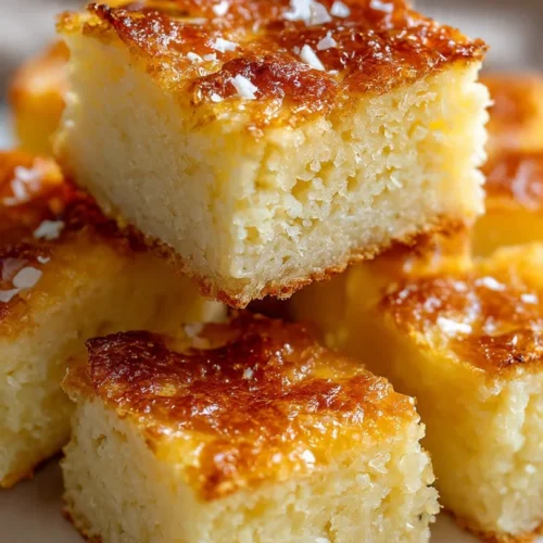 Paula Deen's Soft Sticky Butter Cake served on a plate, highlighting its rich texture.
