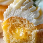 Pineapple cupcakes with pineapple frosting on a white plate