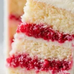 Delicious raspberry lemon cake with fresh raspberries and lemon slices