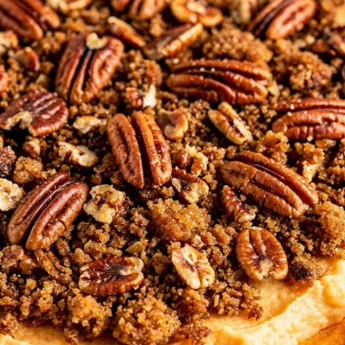 Ruth's Chris Sweet Potato Casserole topped with marshmallows and pecans