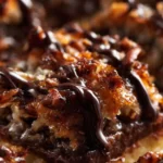 Delicious slice of Samoa Pie with layers of coconut, caramel, and chocolate.