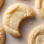 Soft and chewy sugar cookies on a white plate ready to enjoy