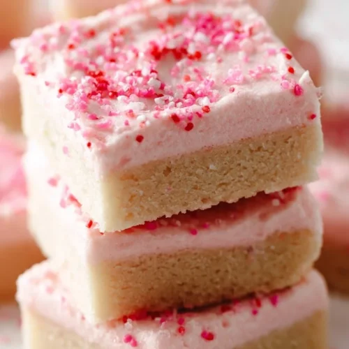 Delicious homemade sugar cookie bars decorated with colorful sprinkles
