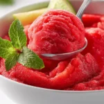 Homemade 5 Minute Watermelon Sorbet in a bowl with fresh watermelon slices