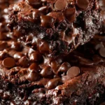 Delicious Chocolate Dump Cake topped with chocolate frosting and berries