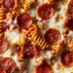 Easy cheesy pepperoni pizza casserole dish ready to serve.