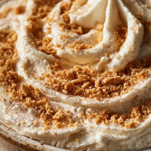 Delicious easy churro dip served in a bowl with cinnamon sugar sprinkles
