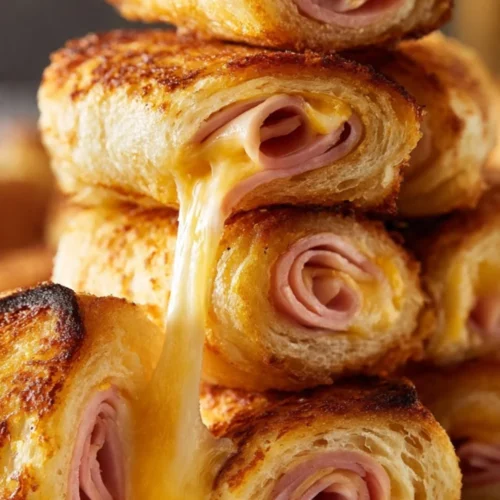 Easy crispy grilled cheese roll-ups served on a plate