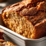 Freshly baked Fig & Date Nut Bread with nuts and dried figs.