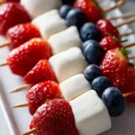 Colorful fruit kabobs with a variety of fresh fruits on skewers.