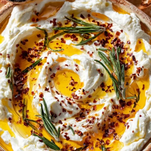 Delicious hot honey cream cheese dip served with crackers and fruits