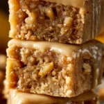 Delicious maple glazed apple blondies with fresh apples on a plate