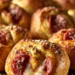Pepperoni pizza crescent rolls ready to be served on a plate.