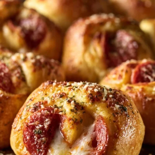Pepperoni pizza crescent rolls ready to be served on a plate.